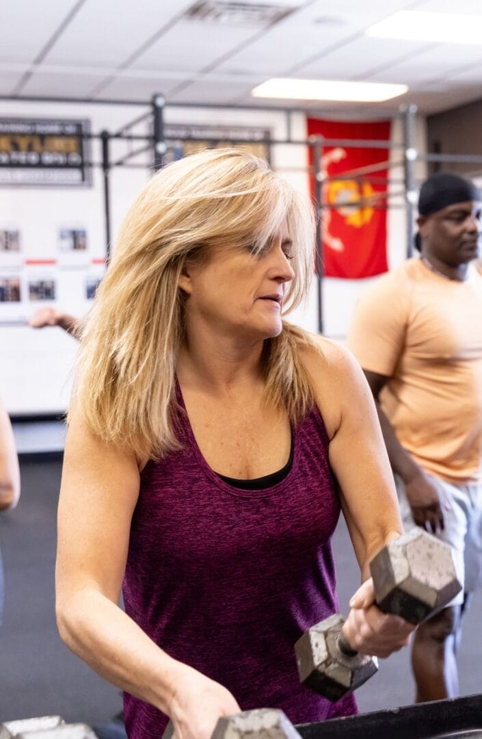 Woman Strength Training with dumbbells
